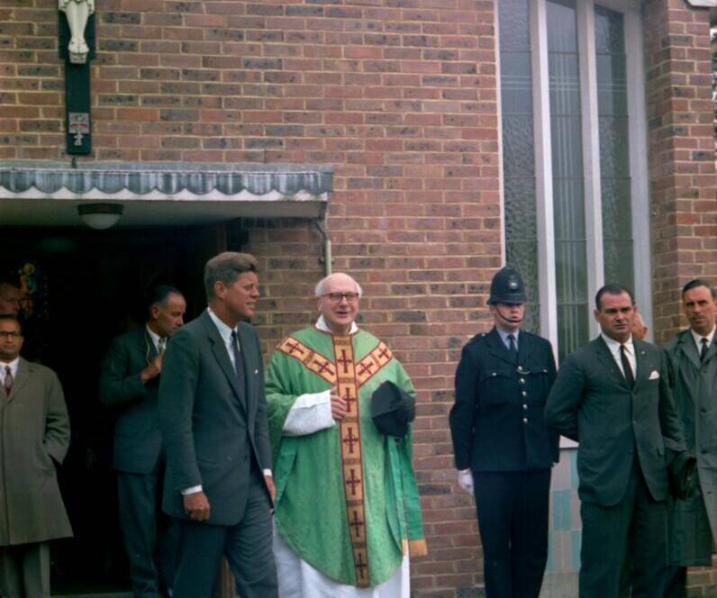 An image of President John F Kennedy outside Our Lady of the Forest with Fr Dolan